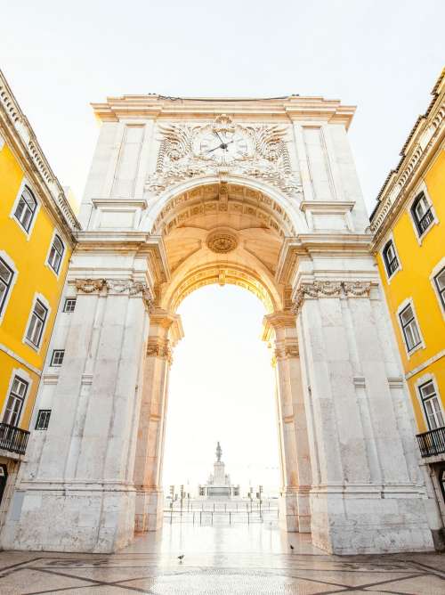 View on the Triumphal arch on the Commerce square during the sunrise in Lisbon city, Portugal