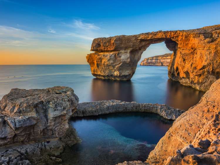 Gozo, Malta - The beautiful Azure Window, a natural arch and famous landmark on the island of Gozo at sunset; Shutterstock ID 588545807; Invoice Number: -