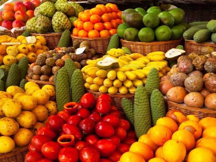 Exotic tropical fruits on the market. Edible bright background