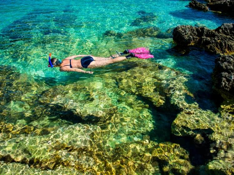 Pretty Woman in Bikini Snorkeling through Turquoise Water at the Coast; Shutterstock ID 518588809; Invoice Number: -