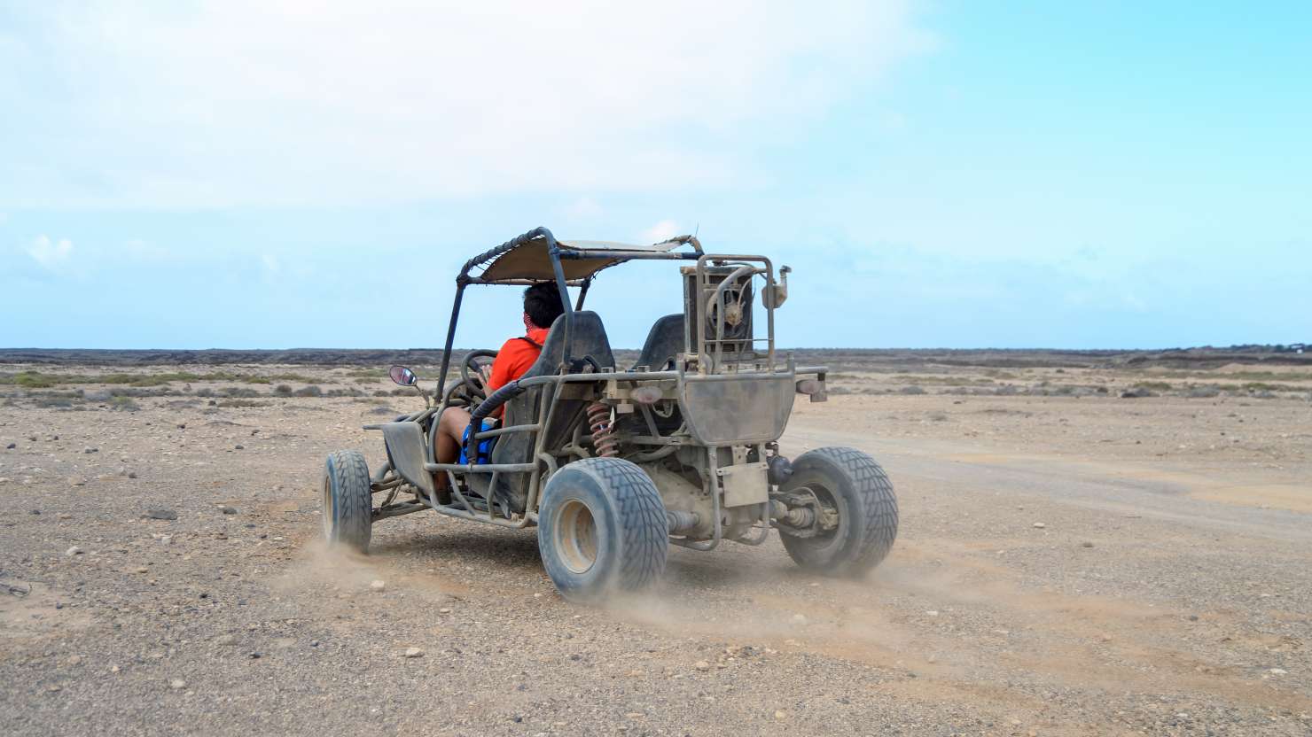 buggy racing on the sand road doing derapage at full speed amidst the desert of Fuerteventura, Canary; Shutterstock ID 797400415; Purchase Order: -