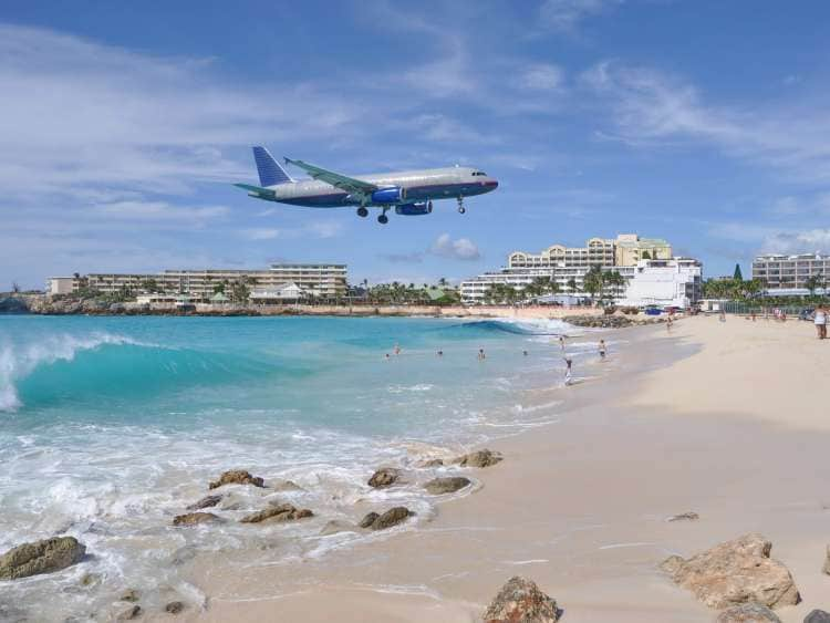  Airplane Landing above Maho Beach in St. Maarten Island; Shutterstock ID 736251334