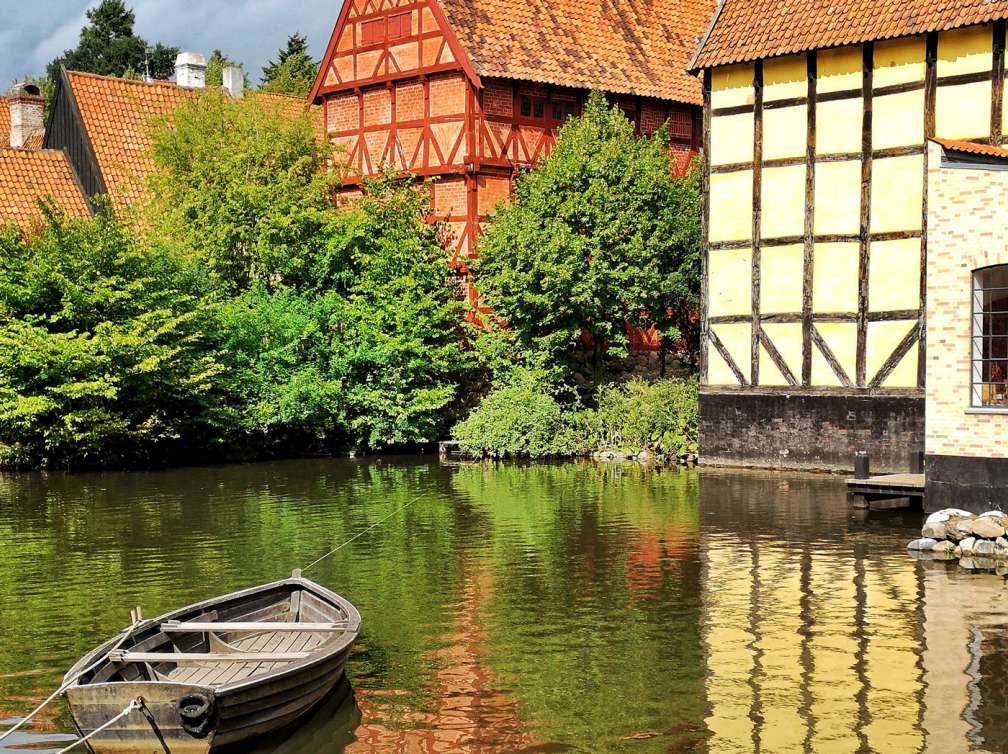 Timbered houses line the water in Aarhus, Denmark