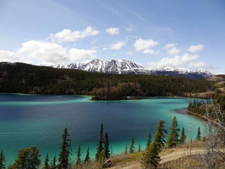 Blue water with mountains in the background in Saguenay, Alaska