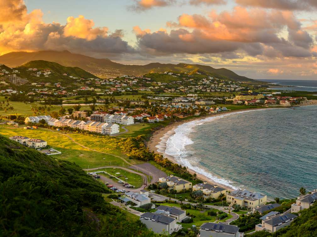 View looking down on Caribbean port of Basseterre at sunset, showing sweeping views of the bay