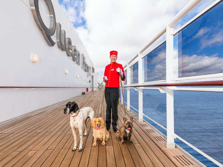 Bellhop with dog on board Queen Mary 2