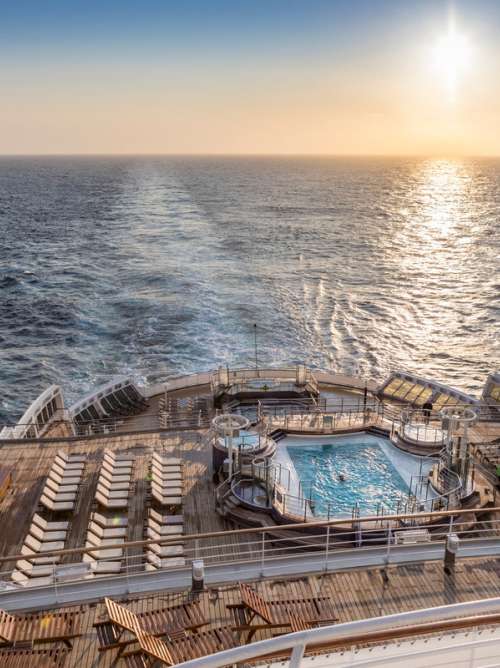 The view from the aft of Queen Mary 2 at sunset