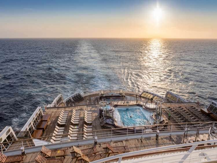 The view from the aft of Queen Mary 2 at sunset