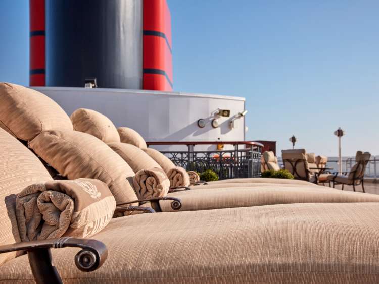 Loungers on the upper Grills Terrace on board Cunard's Queen Elizabeth