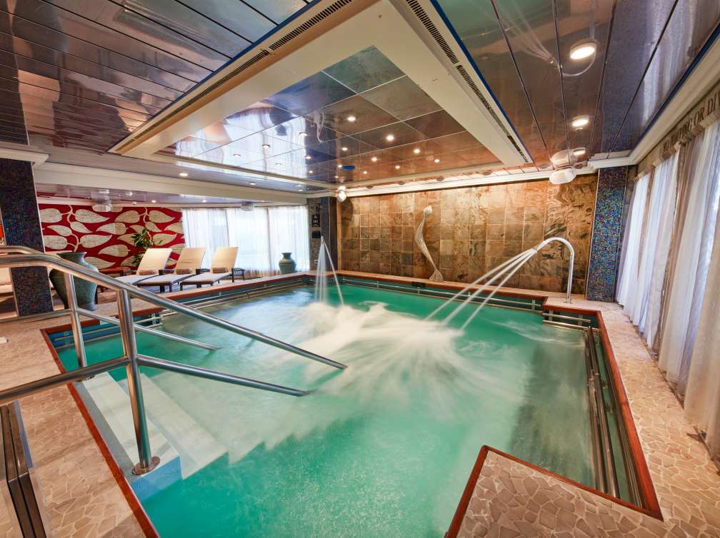 The main pool, with jets and sea views, in the Mareel Spa on board Cunard's Queen Victoria