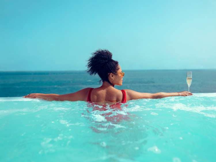 Woman in pool on board a Cunard Queen