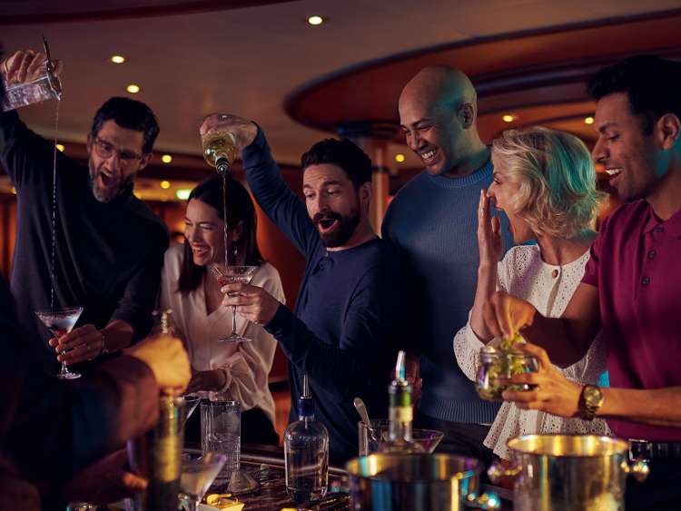 Guests enjoy a cocktail making class on board a Cunard ship