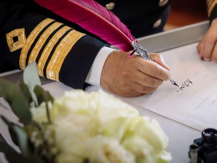 Captain officiating a wedding ceremony on board a Cunard cruise ship