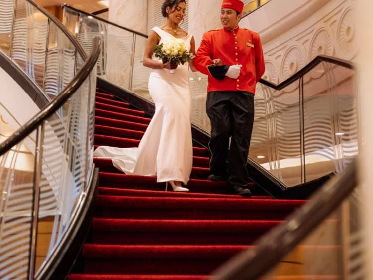 Bride and bellhop in Grand Lobby