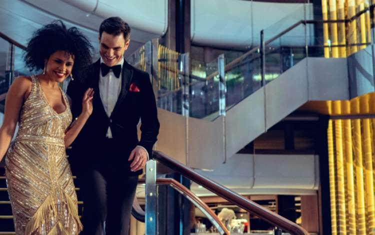 Couple walking through the Queen Anne Grand Lobby on a Gala Evening