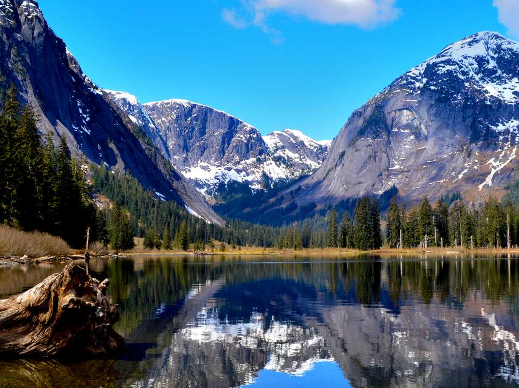 View across the water of mountains in the distance in Misty Fjords, Alaska 