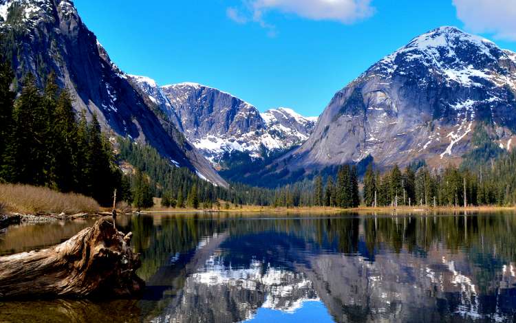 View across the water of mountains in the distance in Misty Fjords, Alaska 