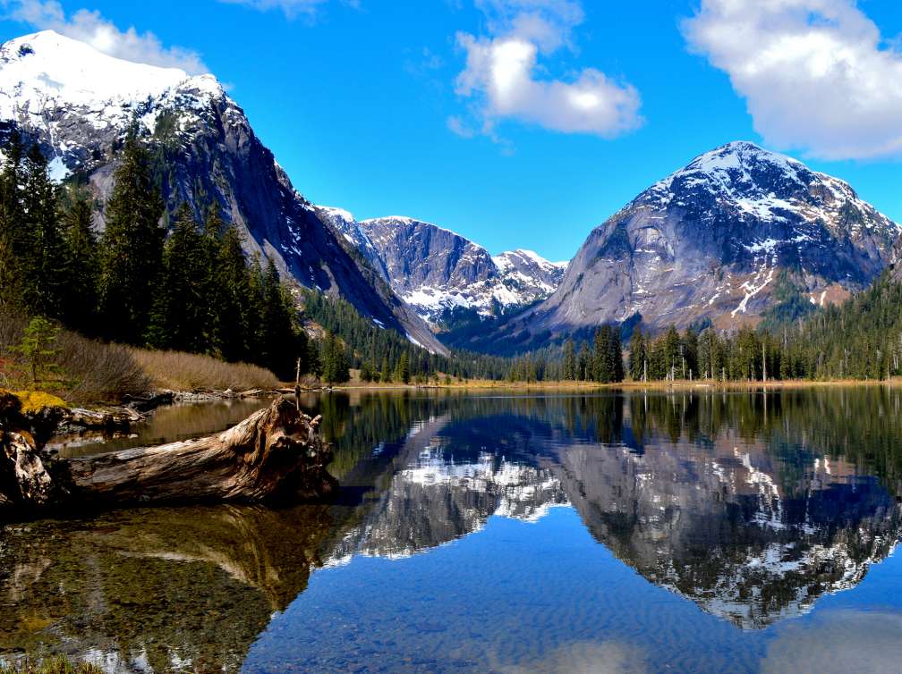 View across the water of mountains in the distance in Misty Fjords, Alaska 