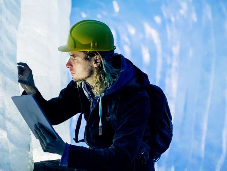 Scientist At An Expedition Site Examining A Glacier; Shutterstock ID 567954448; purchase_order: n/a; job: Glacier Bay - climate; client: cunard_digital; other: As per agreed allowance