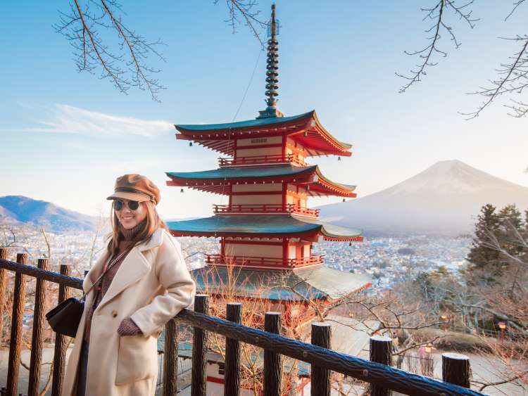 Beautiful woman Tourist smiling on Chureito pagoda and  Fuji mountain, Japan; Shutterstock ID 1321419518; purchase_order: n/a; job: Japan guide images; client: cunard_digital; other: 