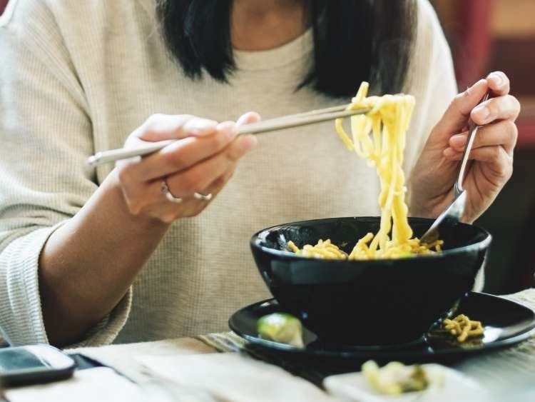 Woman Eating Tasty Noodle Restaurant Concept; Shutterstock ID 489616588; purchase_order: n/a; job: Japan guide images; client: cunard_digital; other: 