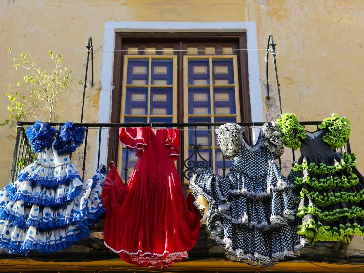 Traditional flamenco dresses at a house in Malaga, Andalusia, Spain.; Shutterstock ID 248154550; Purchase Order: -