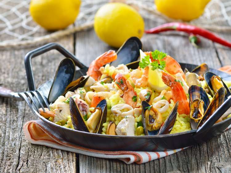 Tasty Spanish paella with seafood and chicken breast; Shutterstock ID 130461026; Purchase Order: -