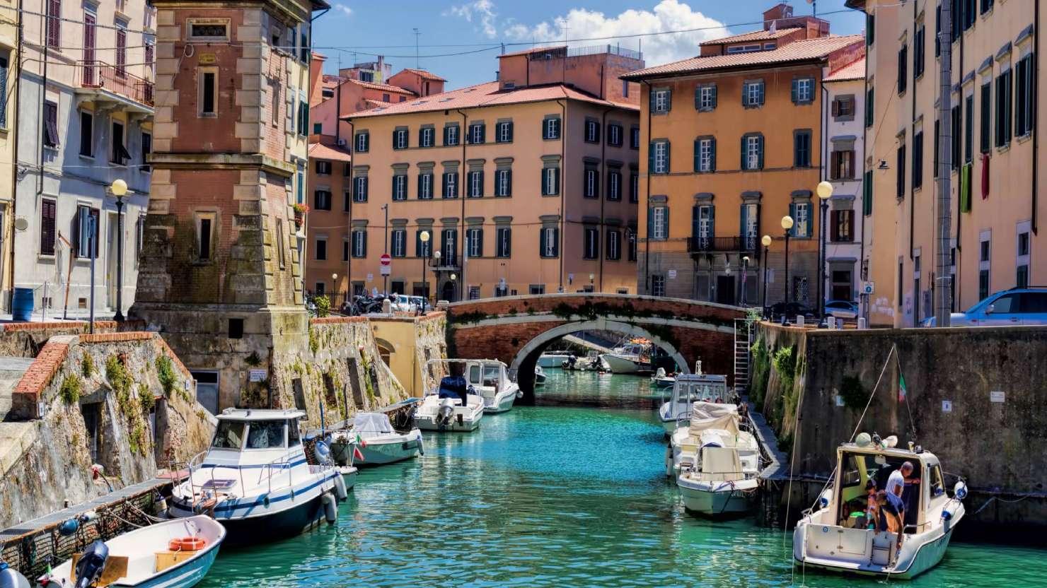 Buildings, canals and boats in the Little Venice district of Livorno, Tuscany, Italy. The Venice quarter is the most charming.