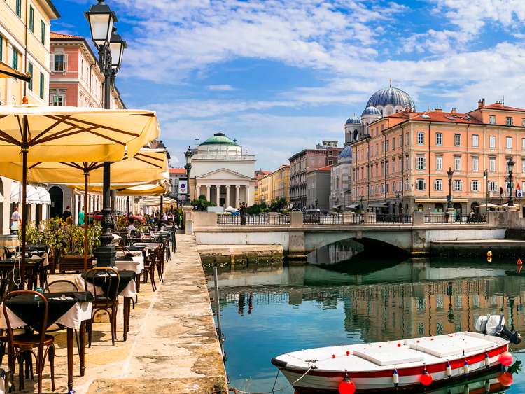 Canal and waterside restaurant in Trieste, Italy