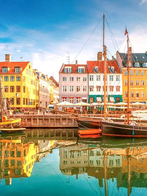 Boats line the quayside in Nyhavn, old town, Copenhagen