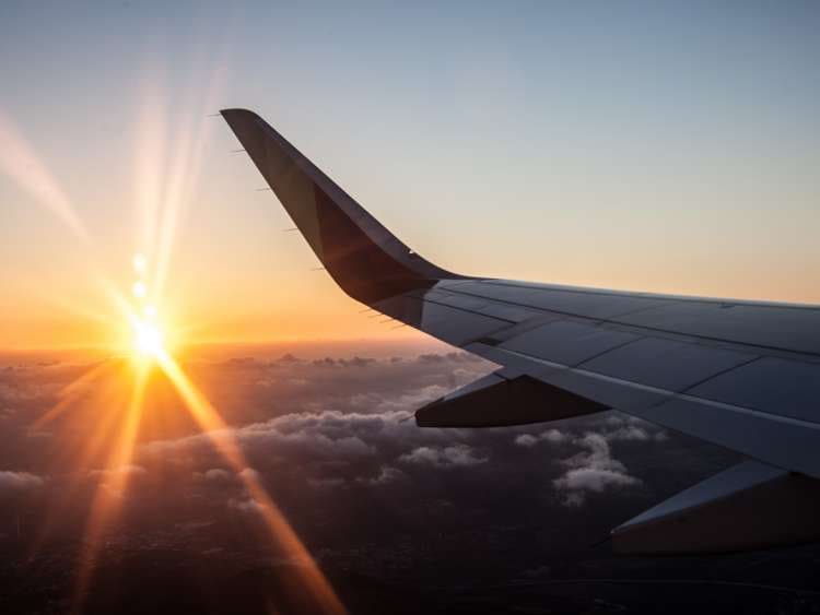 Sunset in airplane with wing