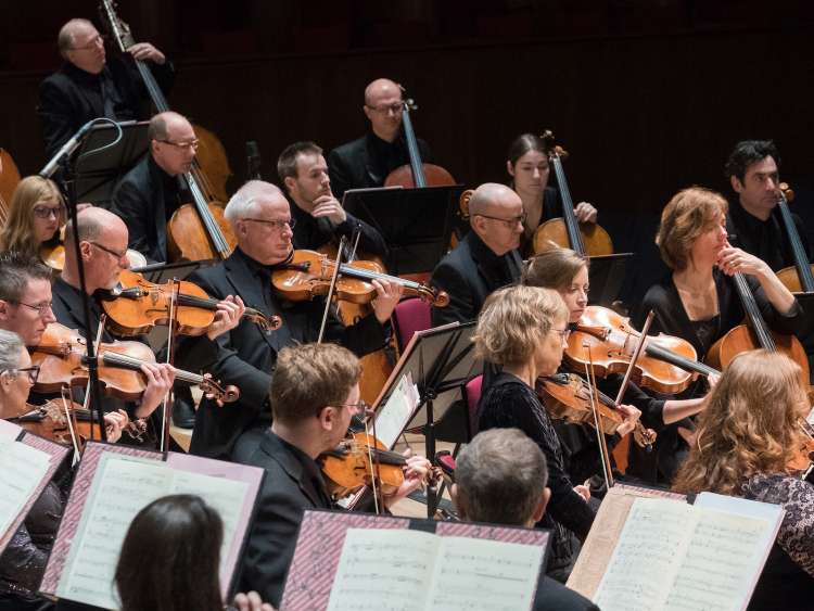 Royal Liverpool Philharmonic Orchestra performing classical music on stage