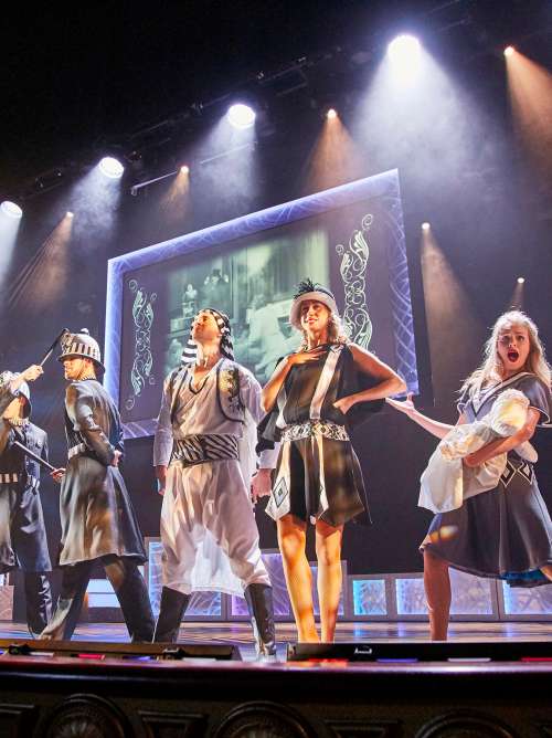 Actors on stage in the Royal Court Theatre