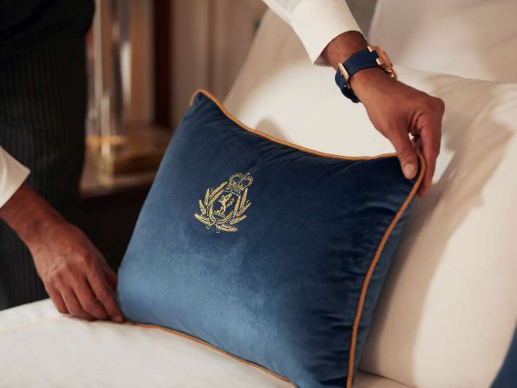 Brand shot of Butler with pillow on QM2