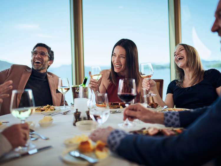 A group of guests enjoying Alternative Dining in the Lido on board a Cunard Queen