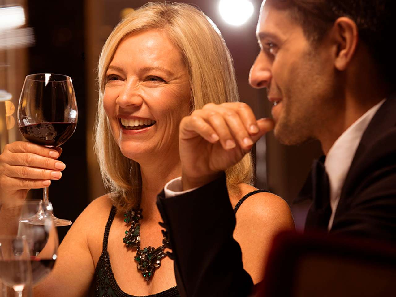 Brand shot of couple dining in Queensgrill QM2