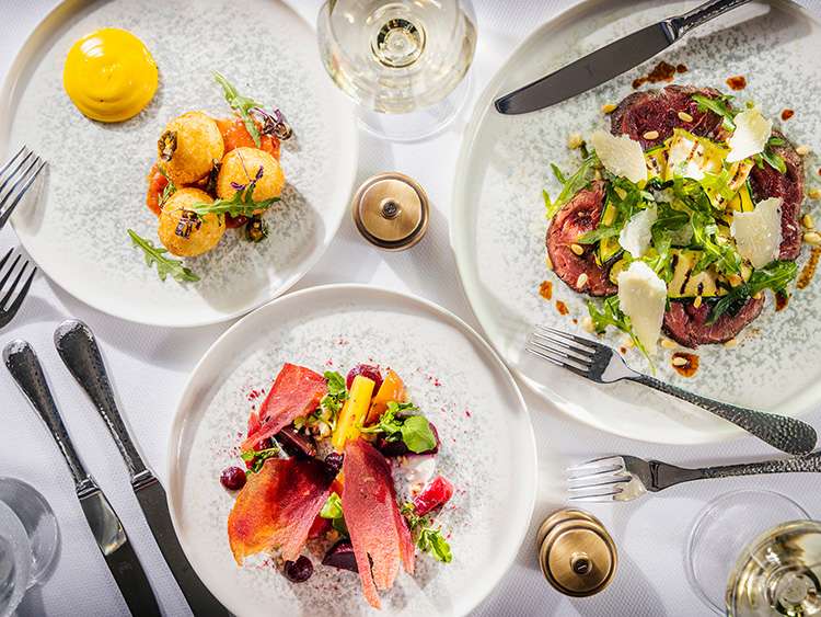 Plates of contemporary cuisine on board a Cunard cruise ship