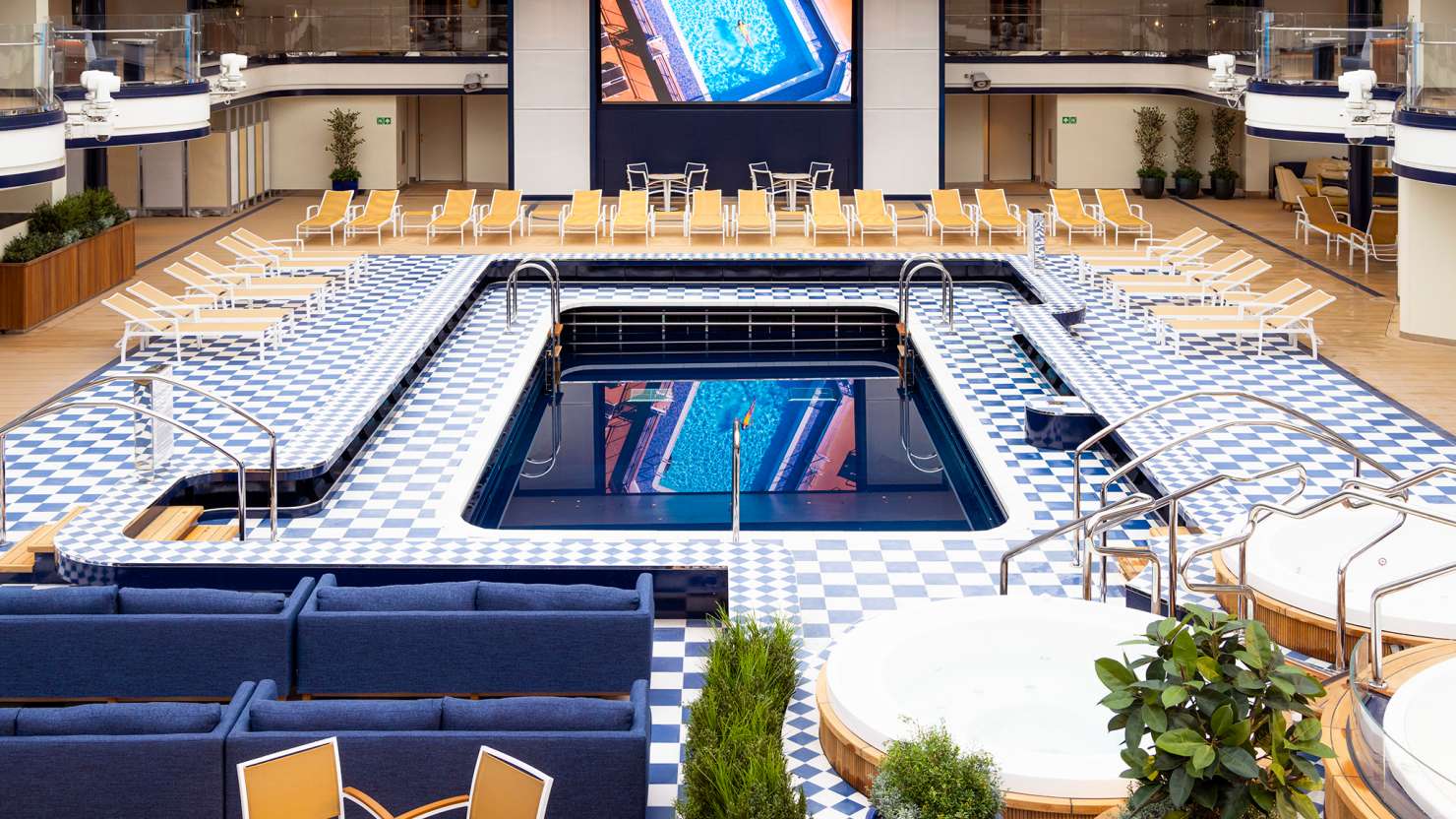 Film showing on the screen at the Pavilion Pool on board Queen Anne