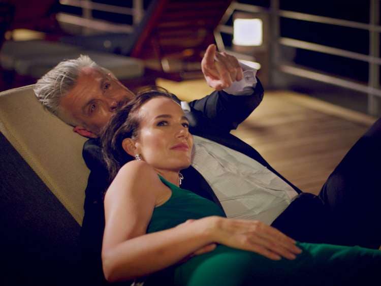 Couple stargazing on the deck of a Cunard ship