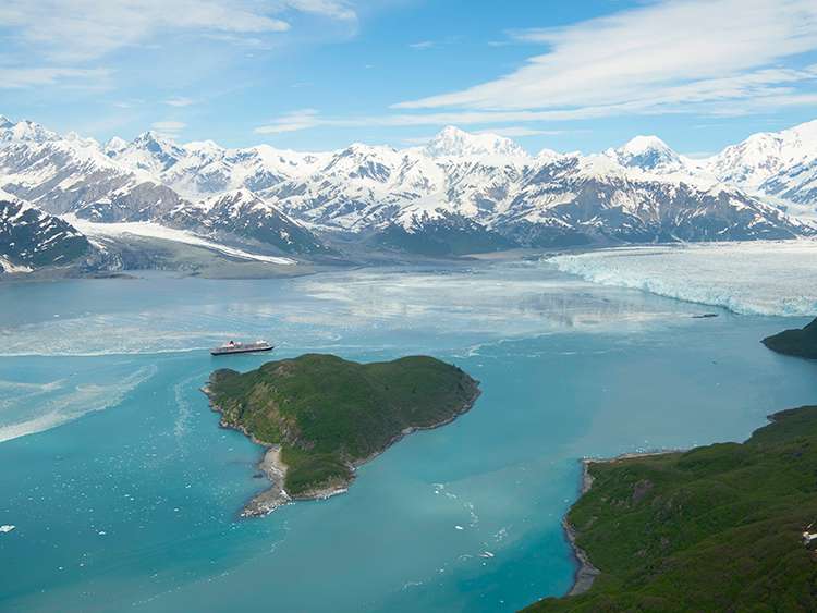 Queen Elizabeth dwarfed by the mighty Hubbard Glacier