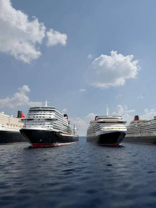 Four Cunard ships sailing by day