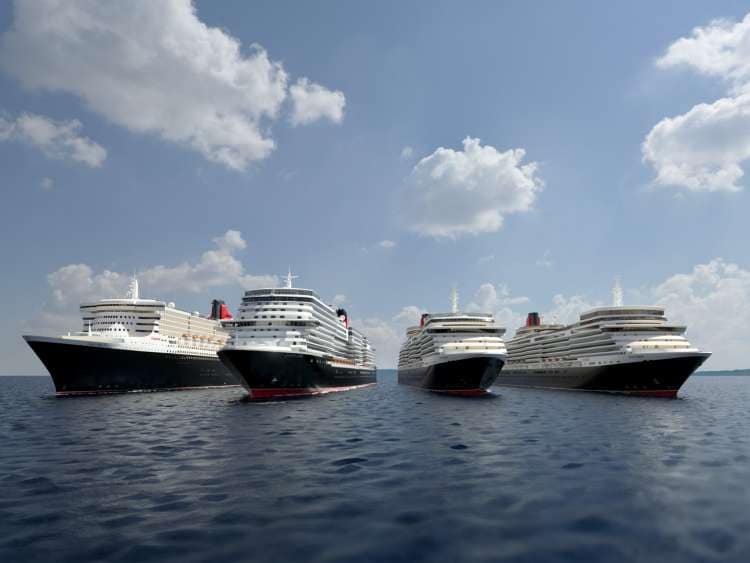 Four Cunard ships sailing by day