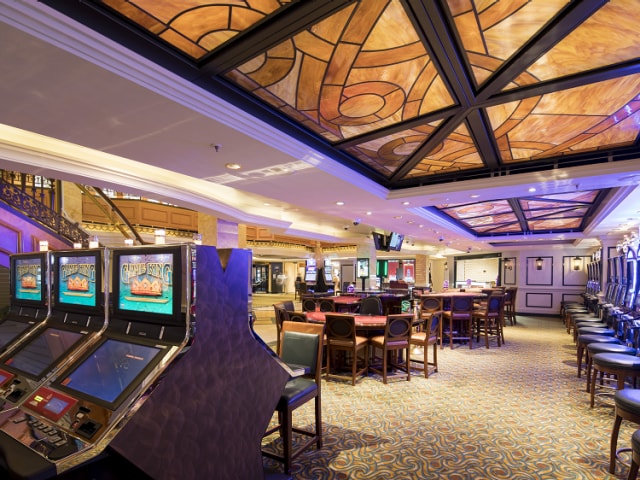 Casino on Queen Elizabeth, showing gaming machines and card tables