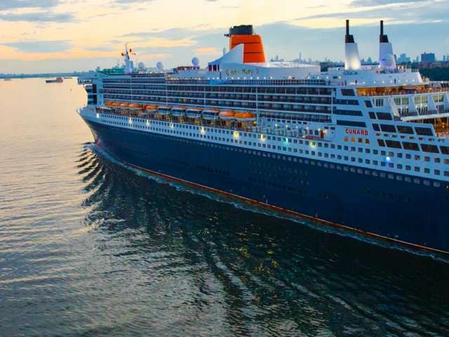 Cunard cruise ship Queen Mary 2 sailing away