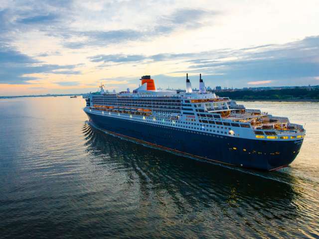 Cunard cruise ship Queen Mary 2 sailing away