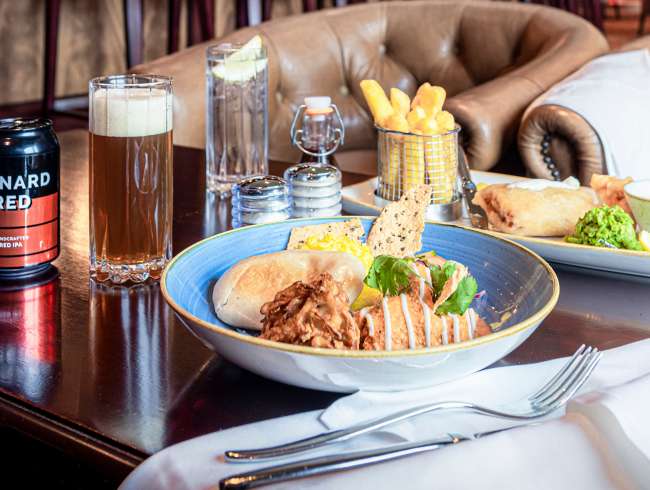 Dining in The Golden Lion pub on board a Cunard cruise ship