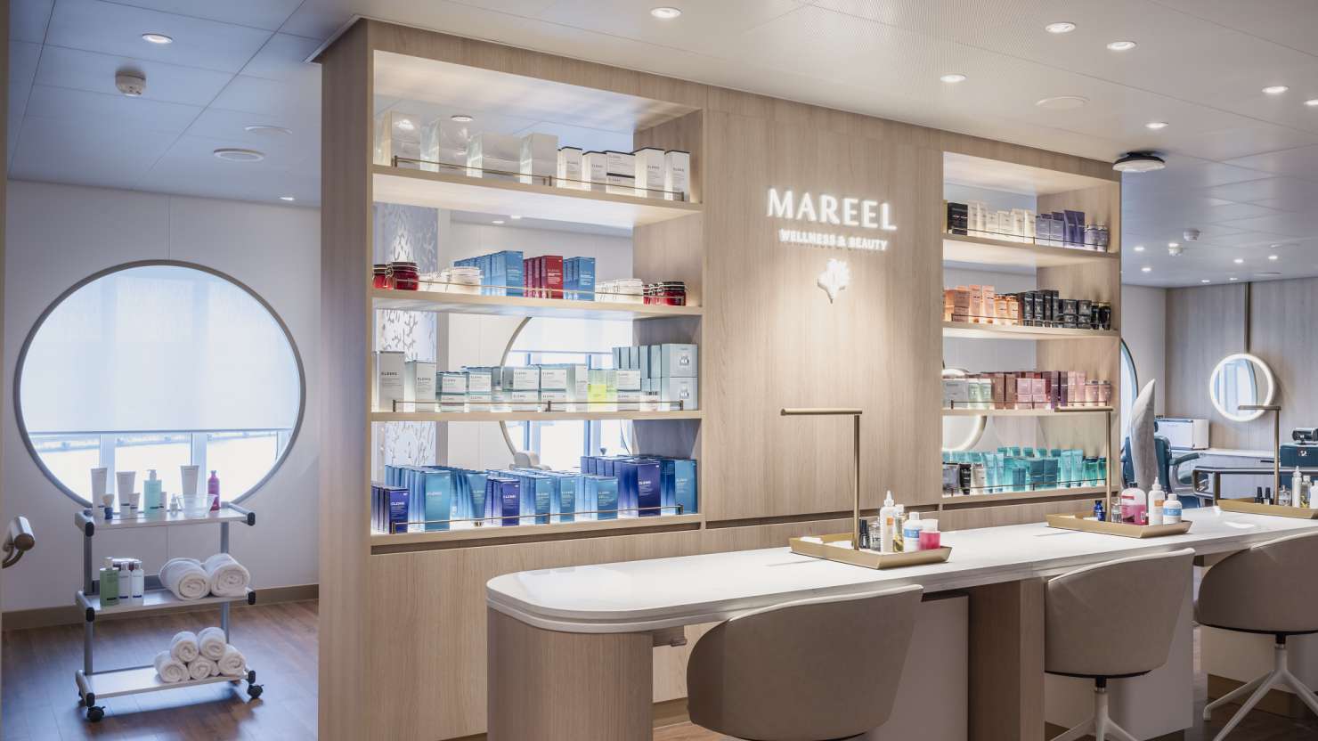 Salon on Queen Anne, showing manicure treatment areas and colourful beauty products on well-lit shelves