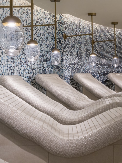 Ceramic heated loungers in Queen Anne's Mareel spa