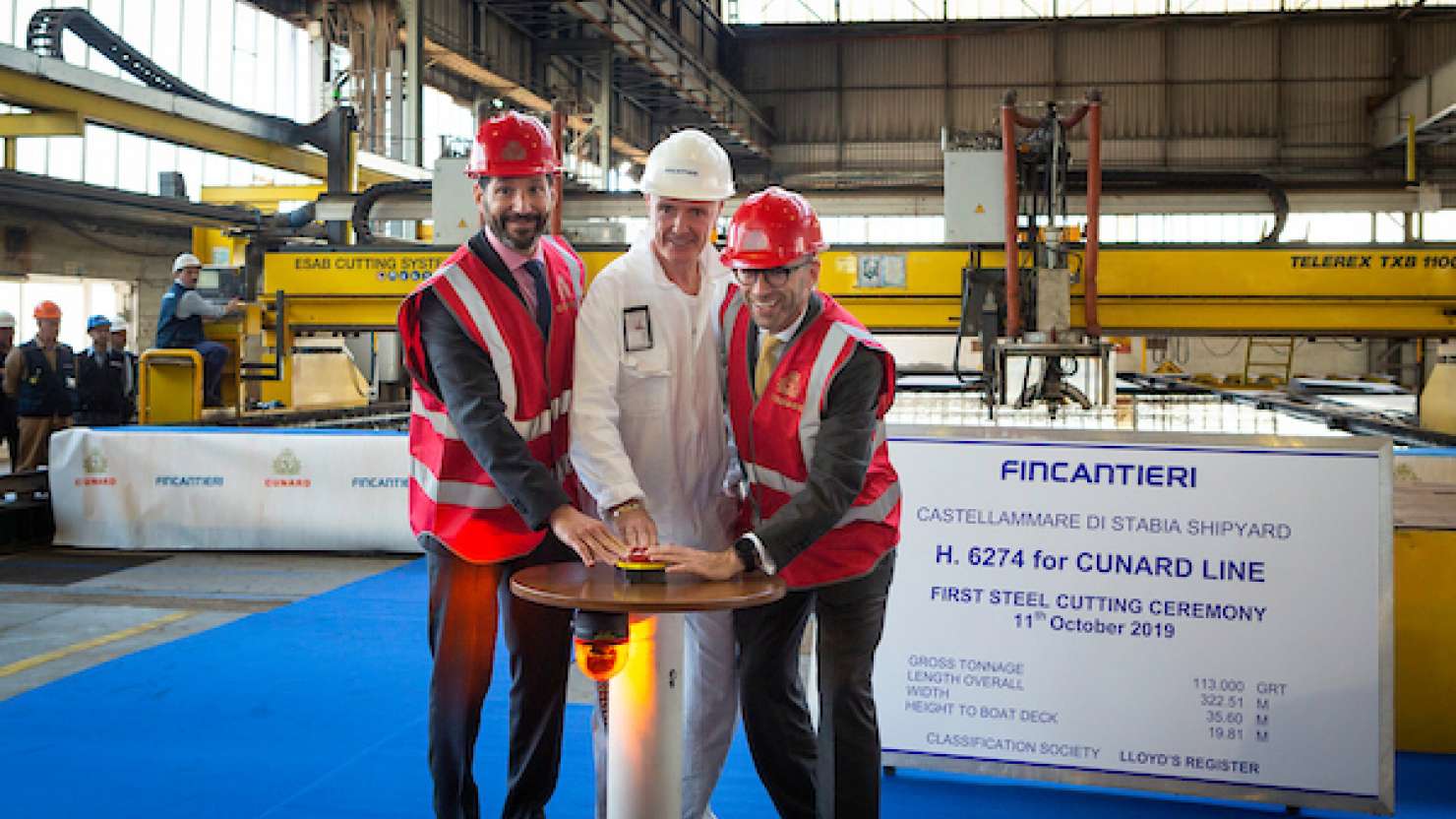 Carnival and Cunard Executives begin the steel-cutting ceremony of Cunard's newest ship.