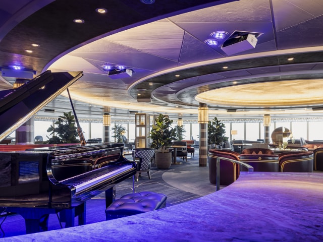 View from the Commodore Club bar on Queen Anne, showing grand piano and specious seating areas